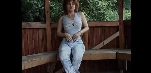  Curly redhaired European housewife Ionela likes to stretch her pussy with toy from sex shop sitting in the arbor
